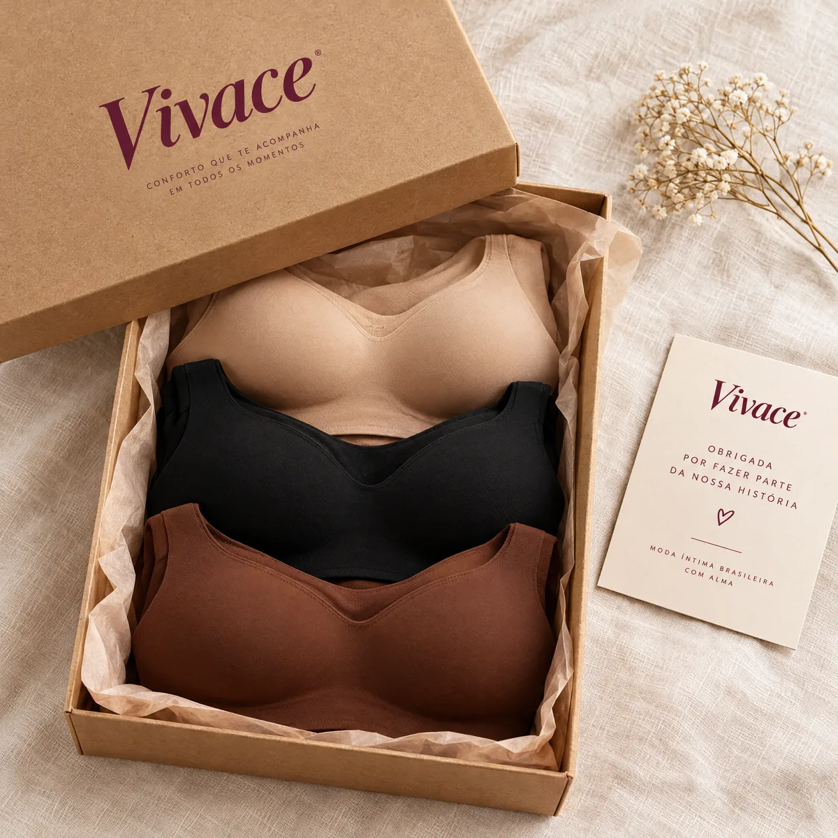 Caixa Vivace aberta com os 3 sutiãs: nude, preto e marrom